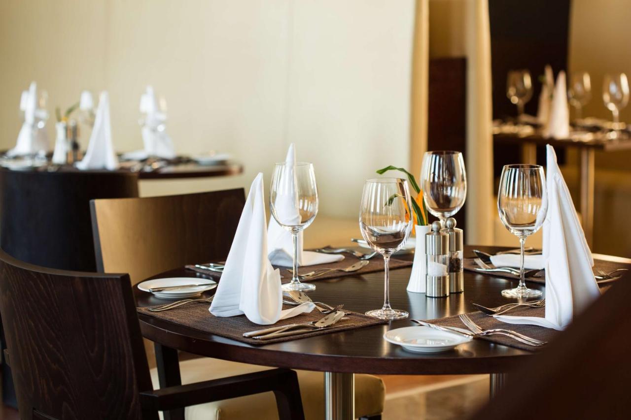 Radisson Blu Hotel & Convention Centre Kigali Zewnętrze zdjęcie A table set for fine dining